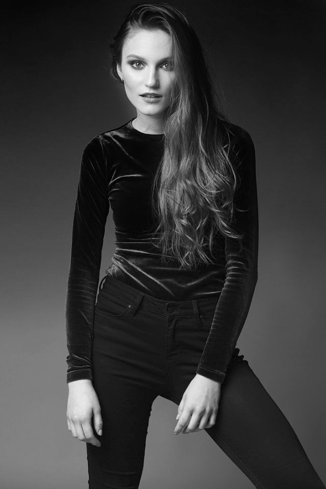 Nastya high-contrast studio portrait. Bold stare.